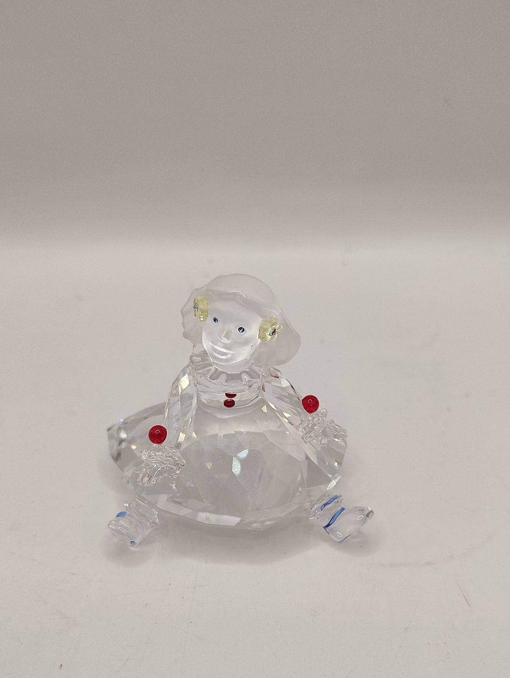 Swarovski Crystal Cheerful Times Doll (model 626247) features intricate Details